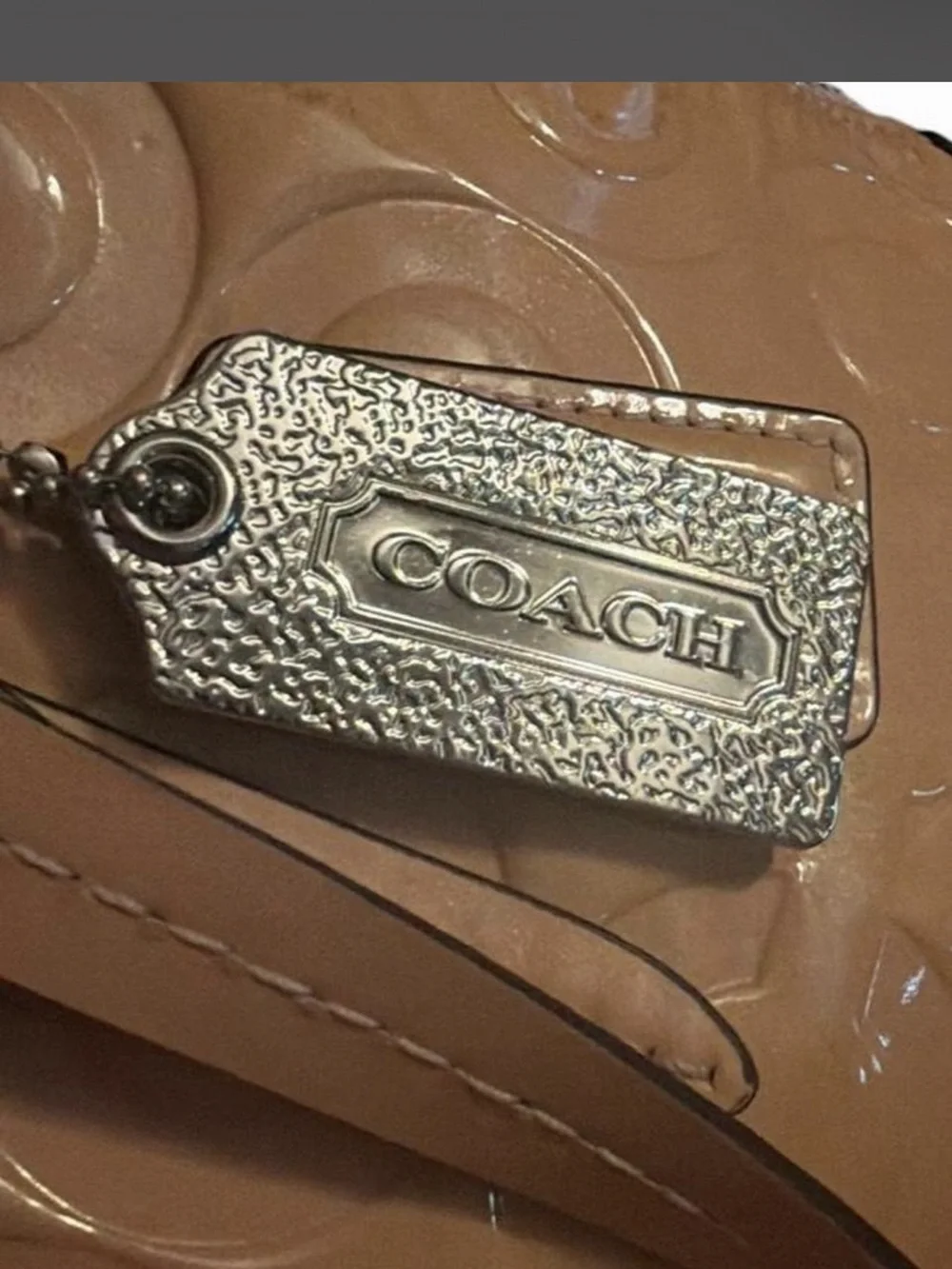 Coach - Peyton Cora in Tan Glossy PVC crossbody with a metallic finish